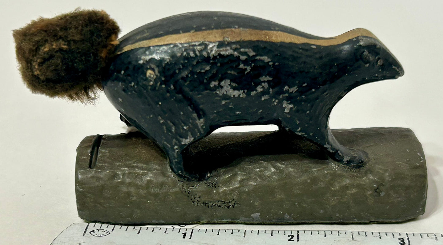 SKUNK METAL PAPERWEIGHT WITH SLOT FOR PENNEY