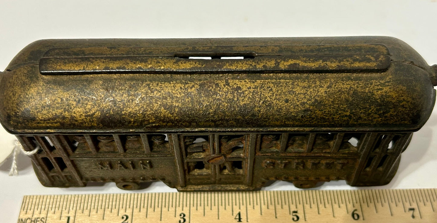 ANTIQUE CAST IRON TROLLY STILL BANK WITH PEOPLE