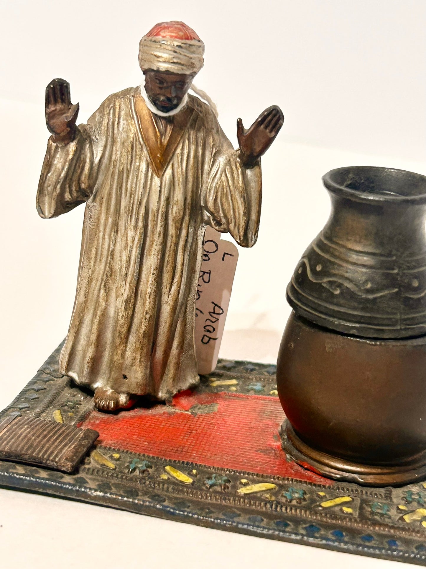 FIGURAL METAL INCENSE BURNER OF ARAB ON RUG