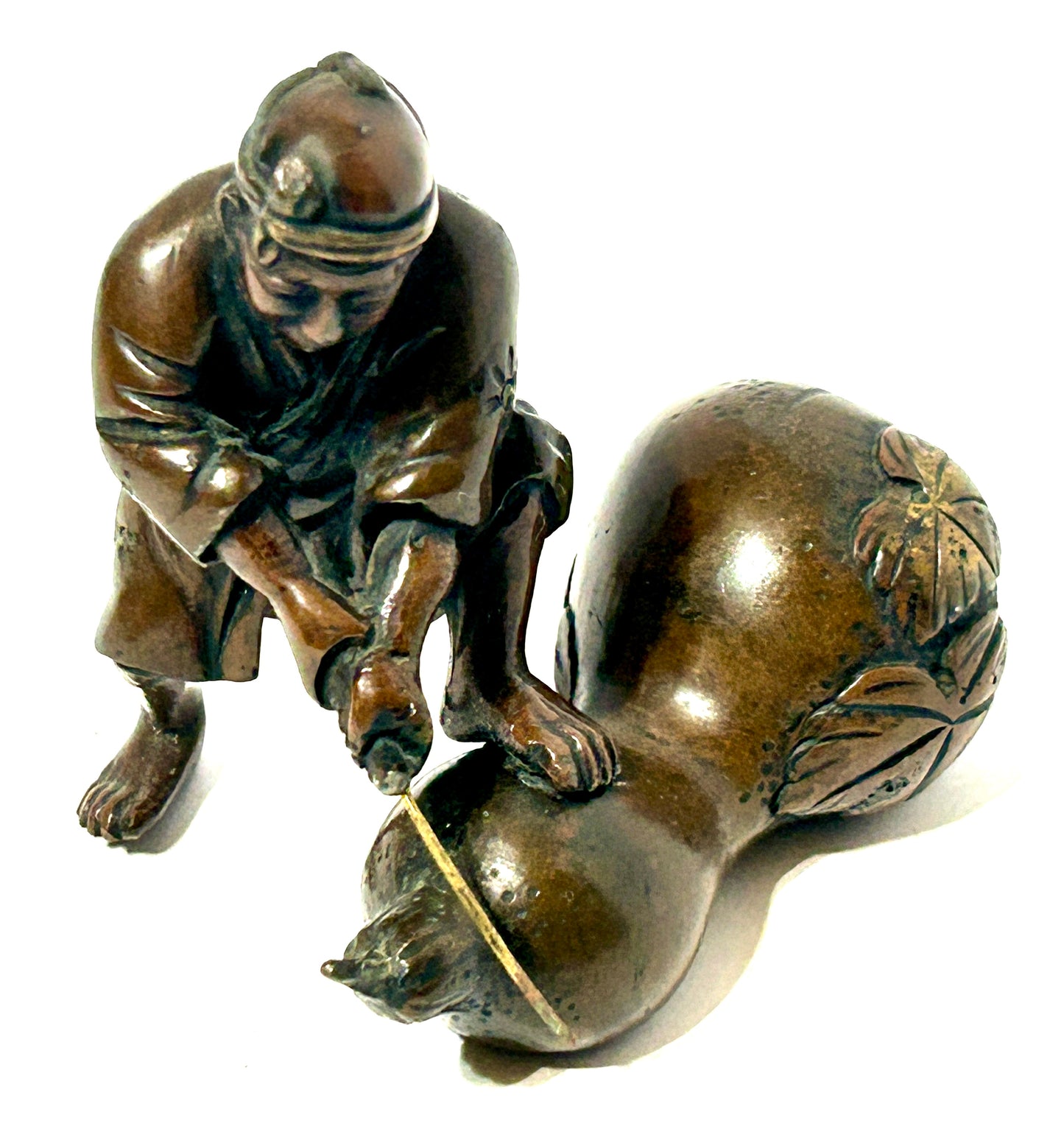 ANTIQUE ASIAN BRONZE OF MAN CUTTING GOURD