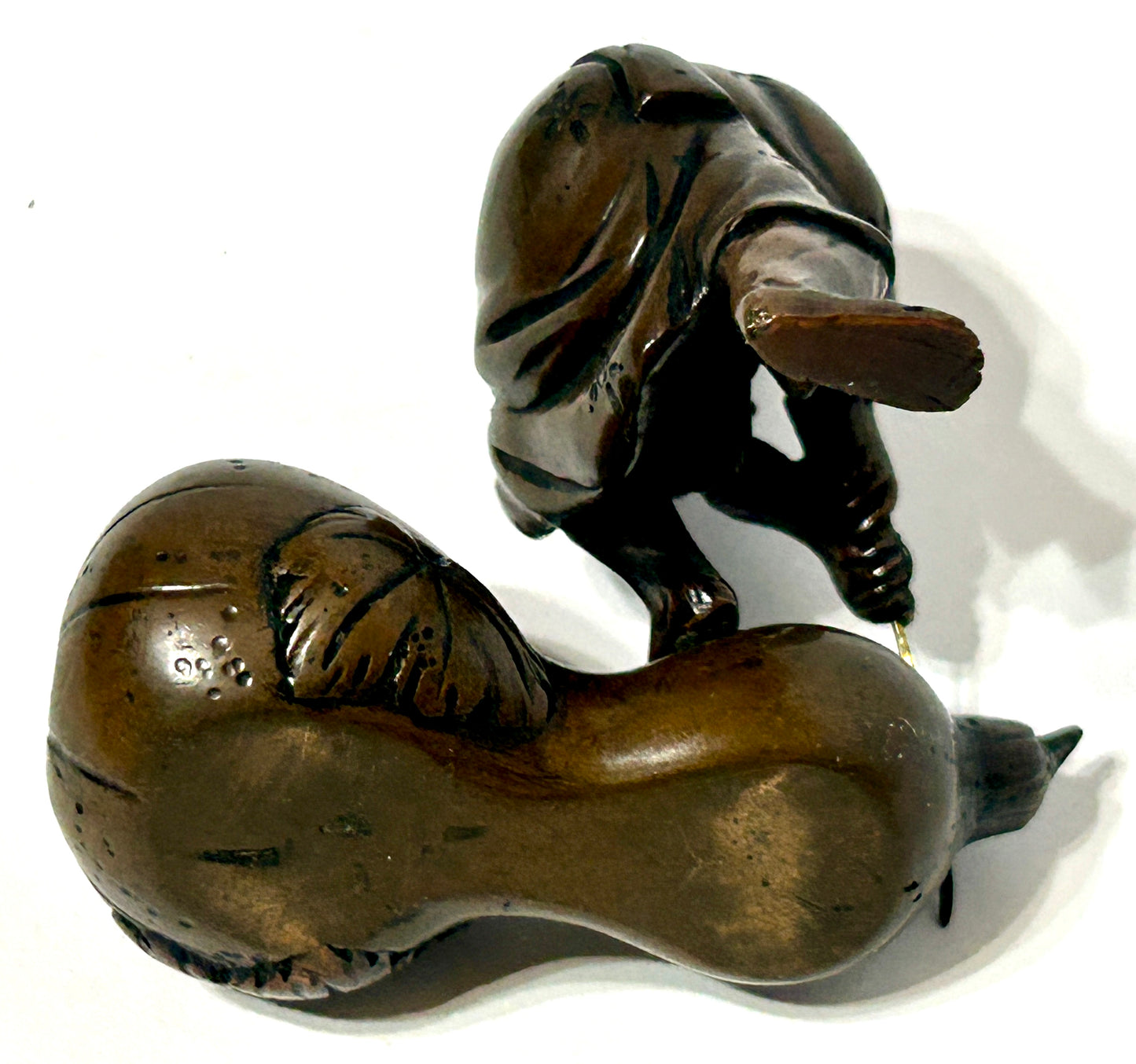 ANTIQUE ASIAN BRONZE OF MAN CUTTING GOURD