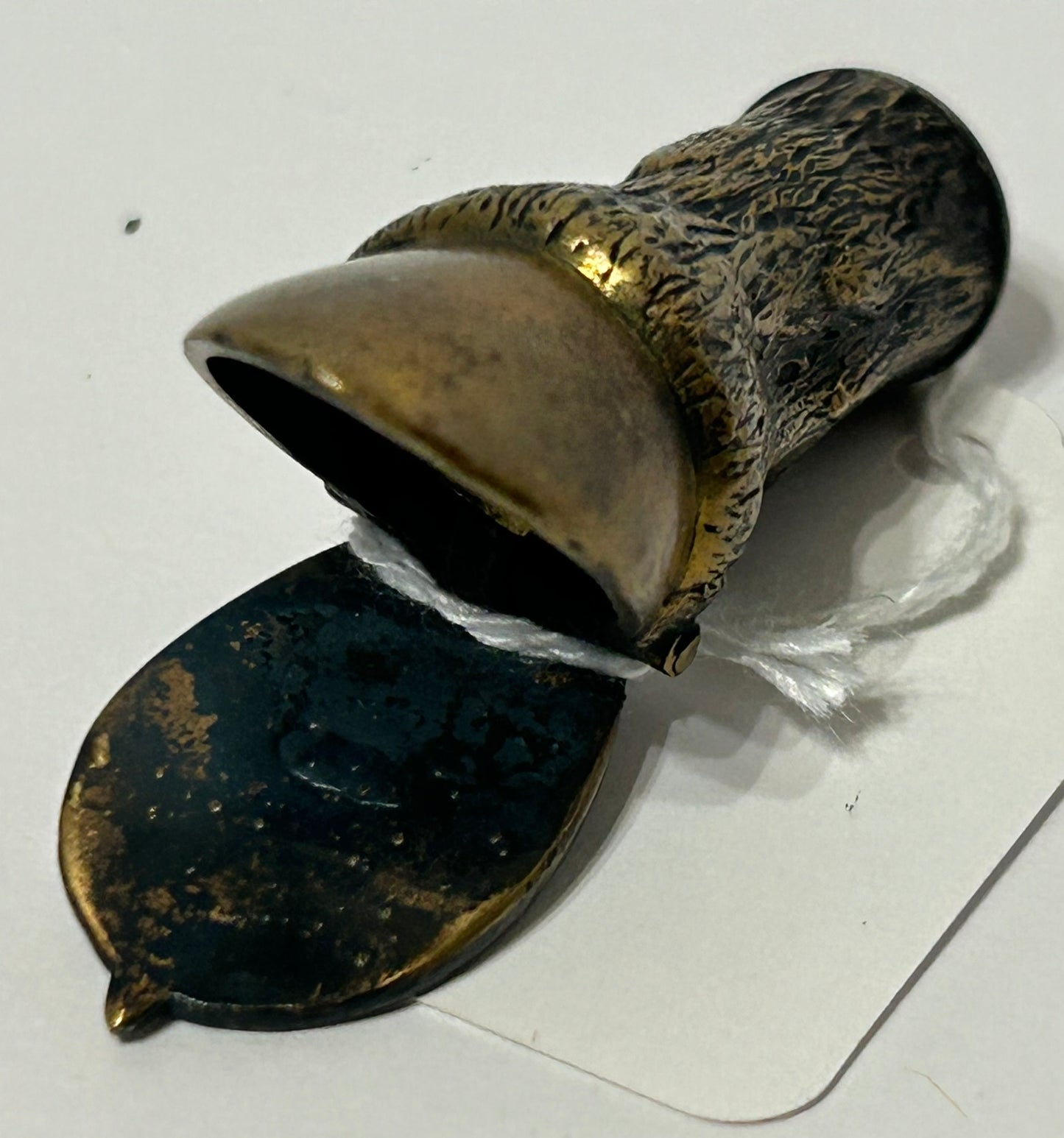 ANTIQUE MATCH HOLDER SHAPED LIKE HORSE HOOF