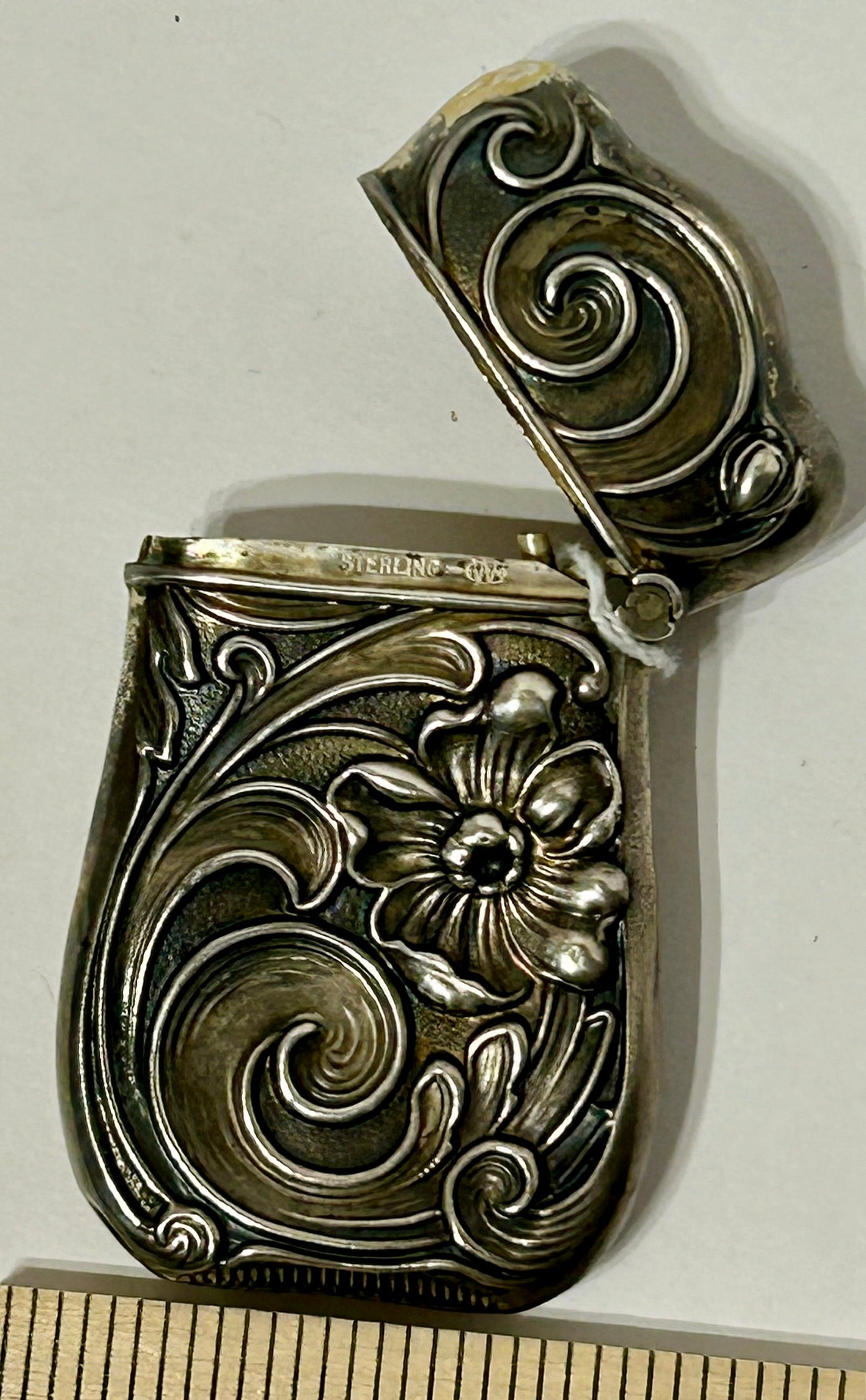 ANTIQUE MATCH SAFE WITH FANCY STERLING DESIGN