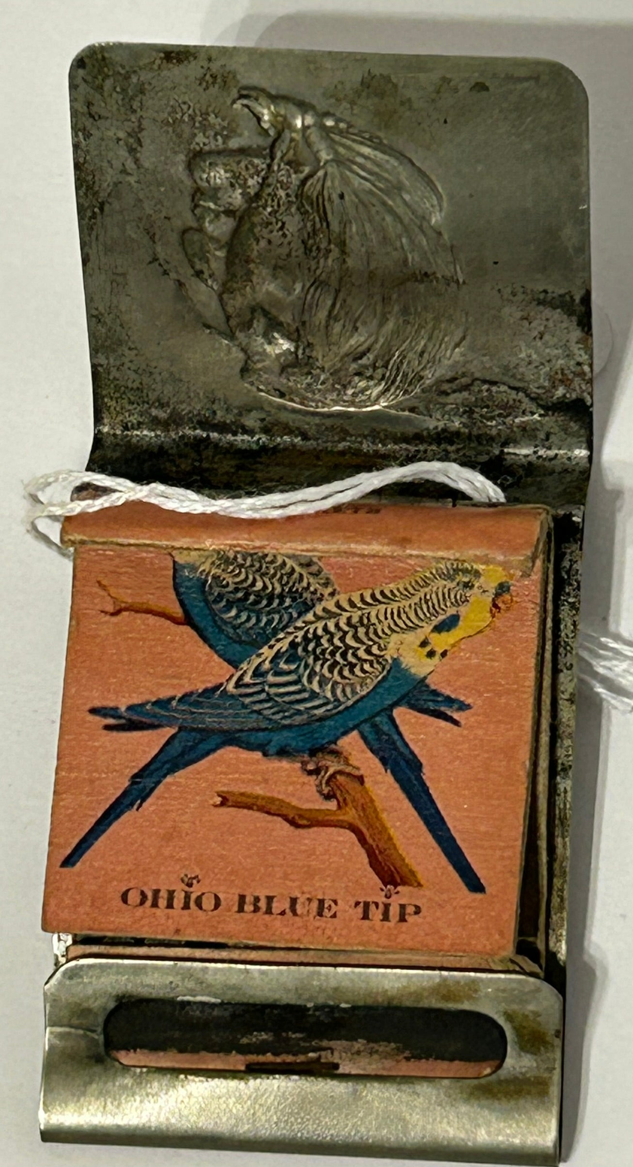 ANTIQUE MATCH BOOK HOLDER WITH NATIVE AMERICAN AND LADY COMBO DESIGN