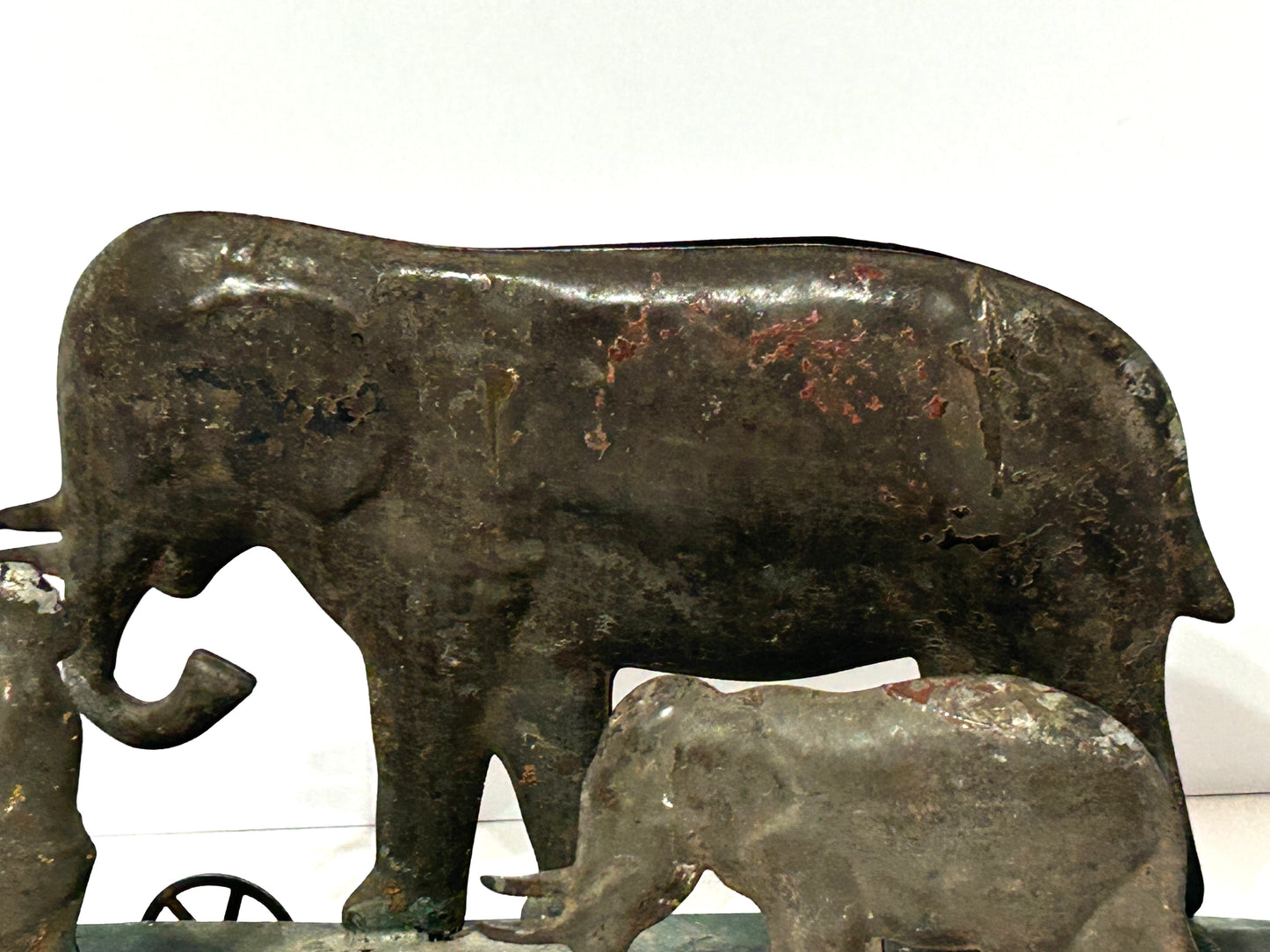 EARLY AMERICAN TIN PLATFORM TOY WITH BOY AND ELEPHANTS