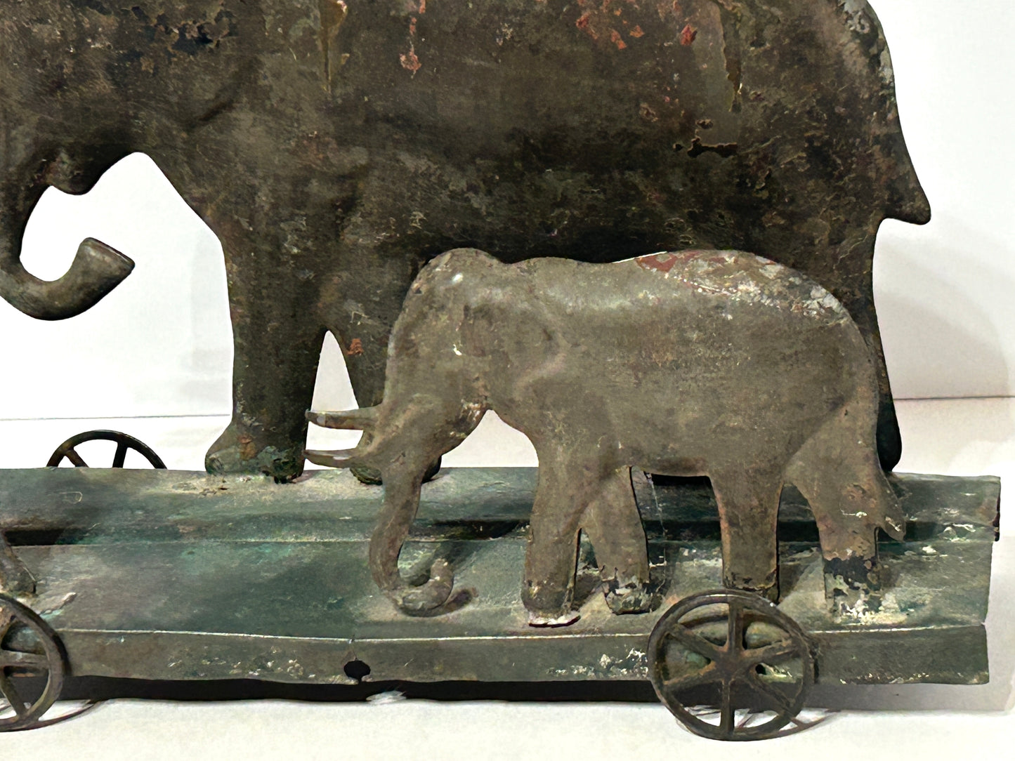 EARLY AMERICAN TIN PLATFORM TOY WITH BOY AND ELEPHANTS