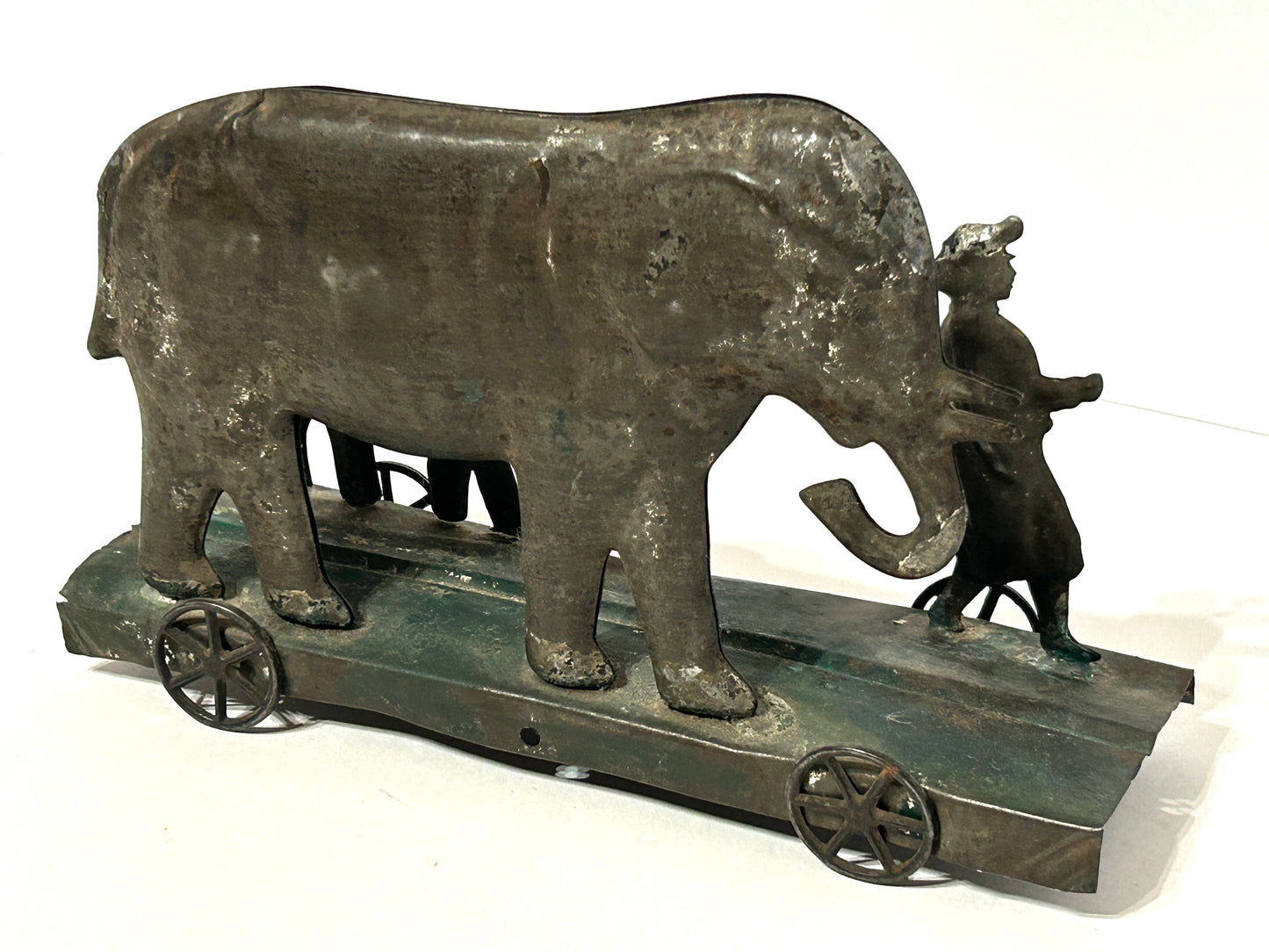 EARLY AMERICAN TIN PLATFORM TOY WITH BOY AND ELEPHANTS
