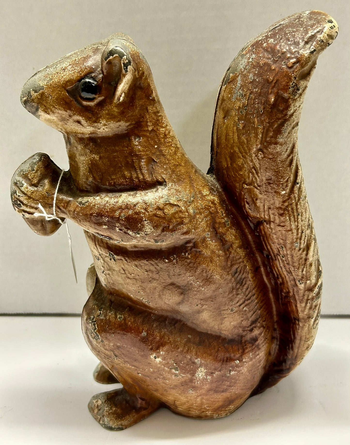 ANTIQUE CAST IRON SQUIRREL HOLDING NUT DOOR STOP