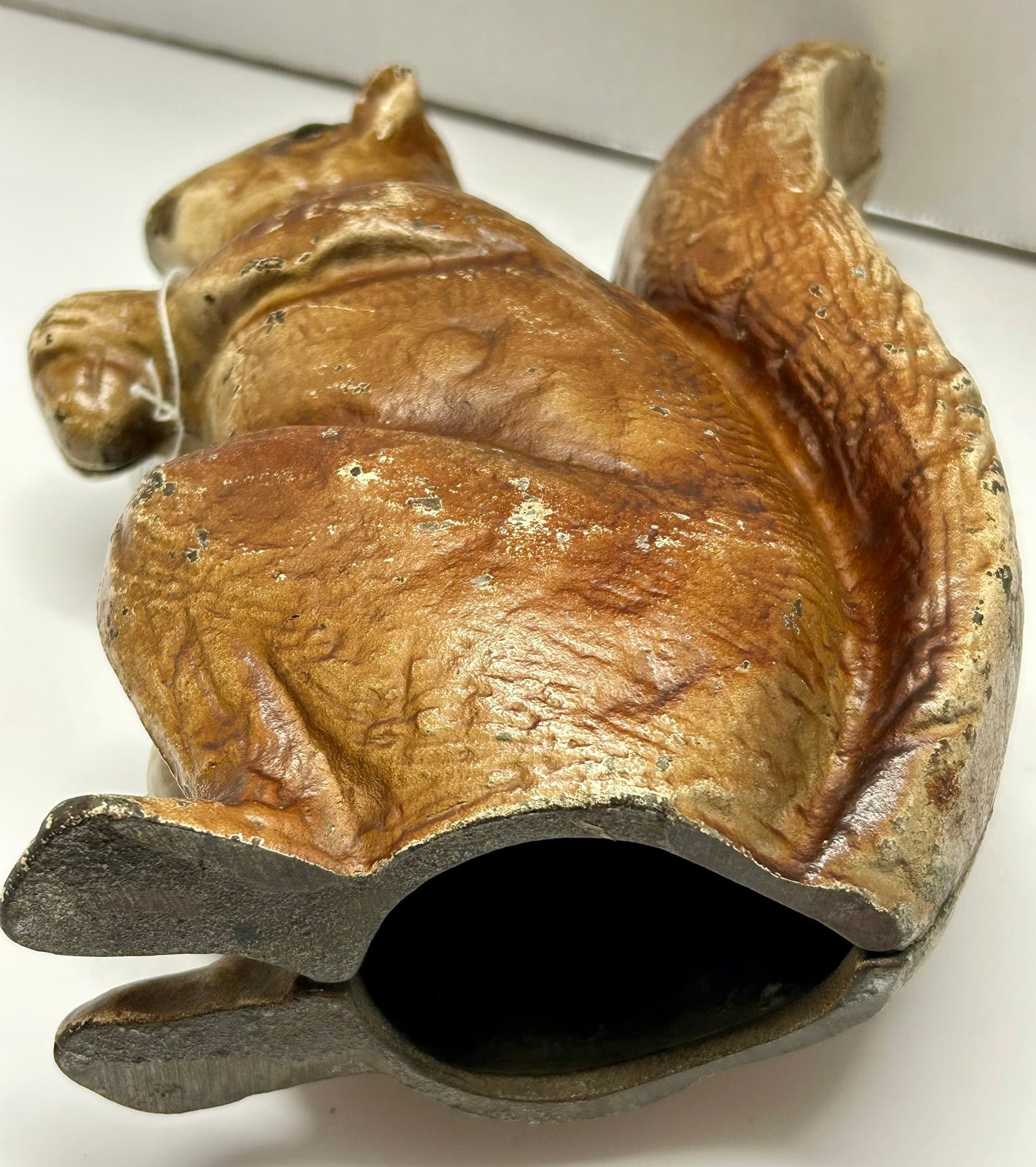 ANTIQUE CAST IRON SQUIRREL HOLDING NUT DOOR STOP