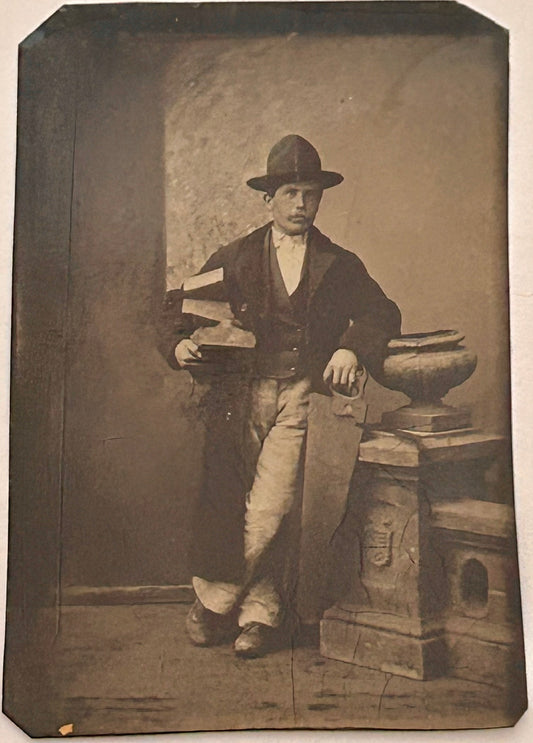 TINTYPE PHOTO OF CARPENTER HOLDING SAW AND PIECES OF WOOD