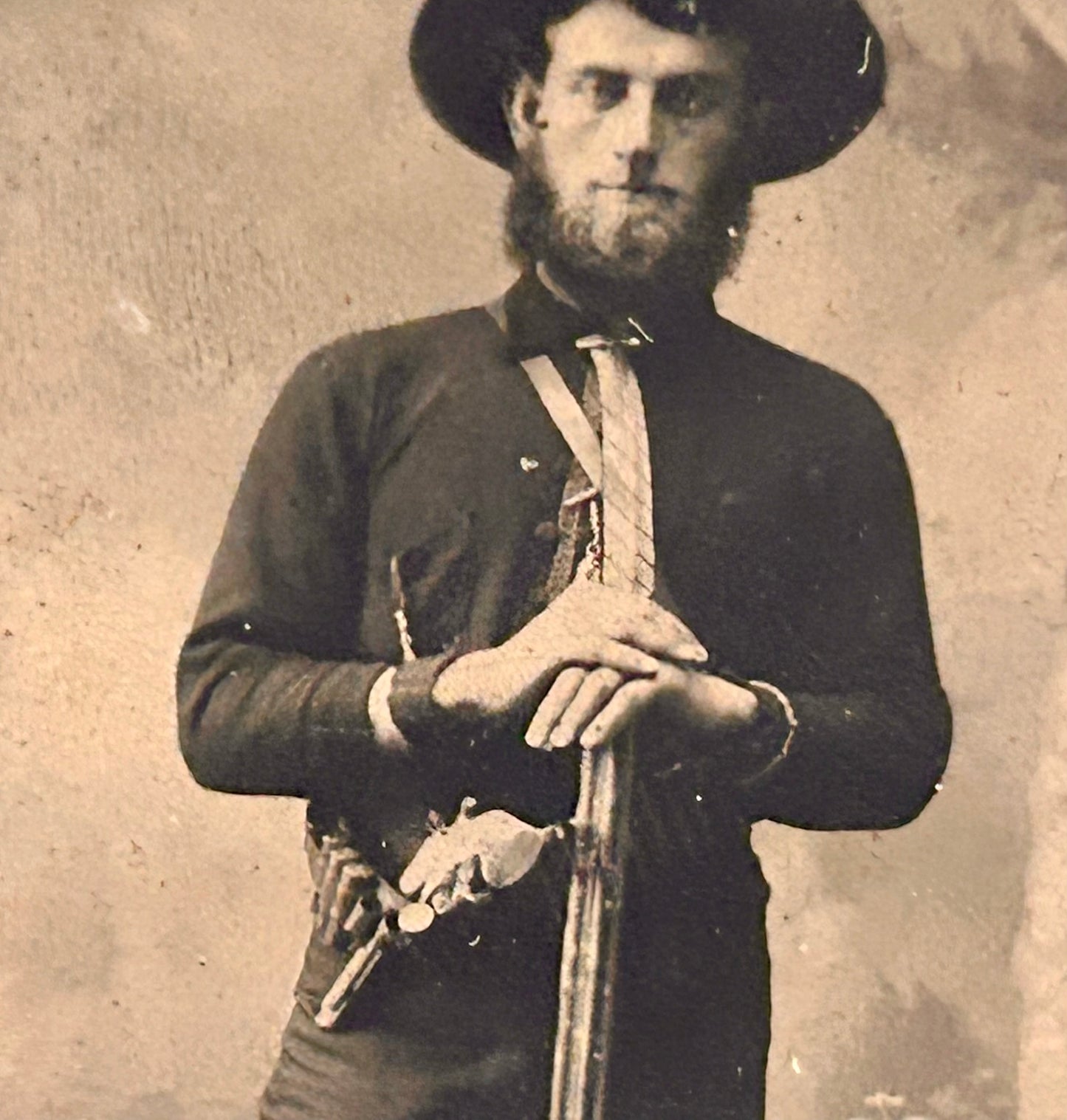 TINTYPE OF MAN WITH SHOTGUN AND PISTOL POSING