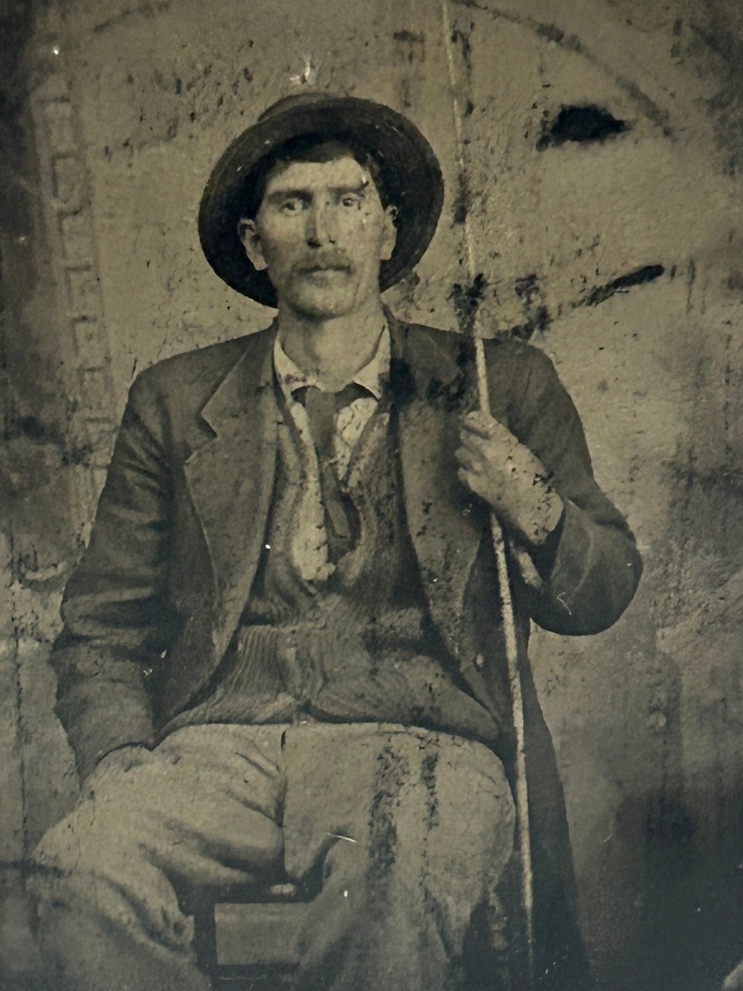 TINTYPE PHOTO OF MAN HOLDING FISHING POLE