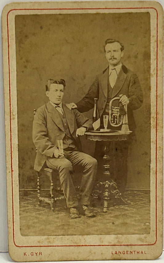ANTIQUE CDV PHOTOGRAPH OF TWO MEN WITH MUSICAL HORN AND WINE