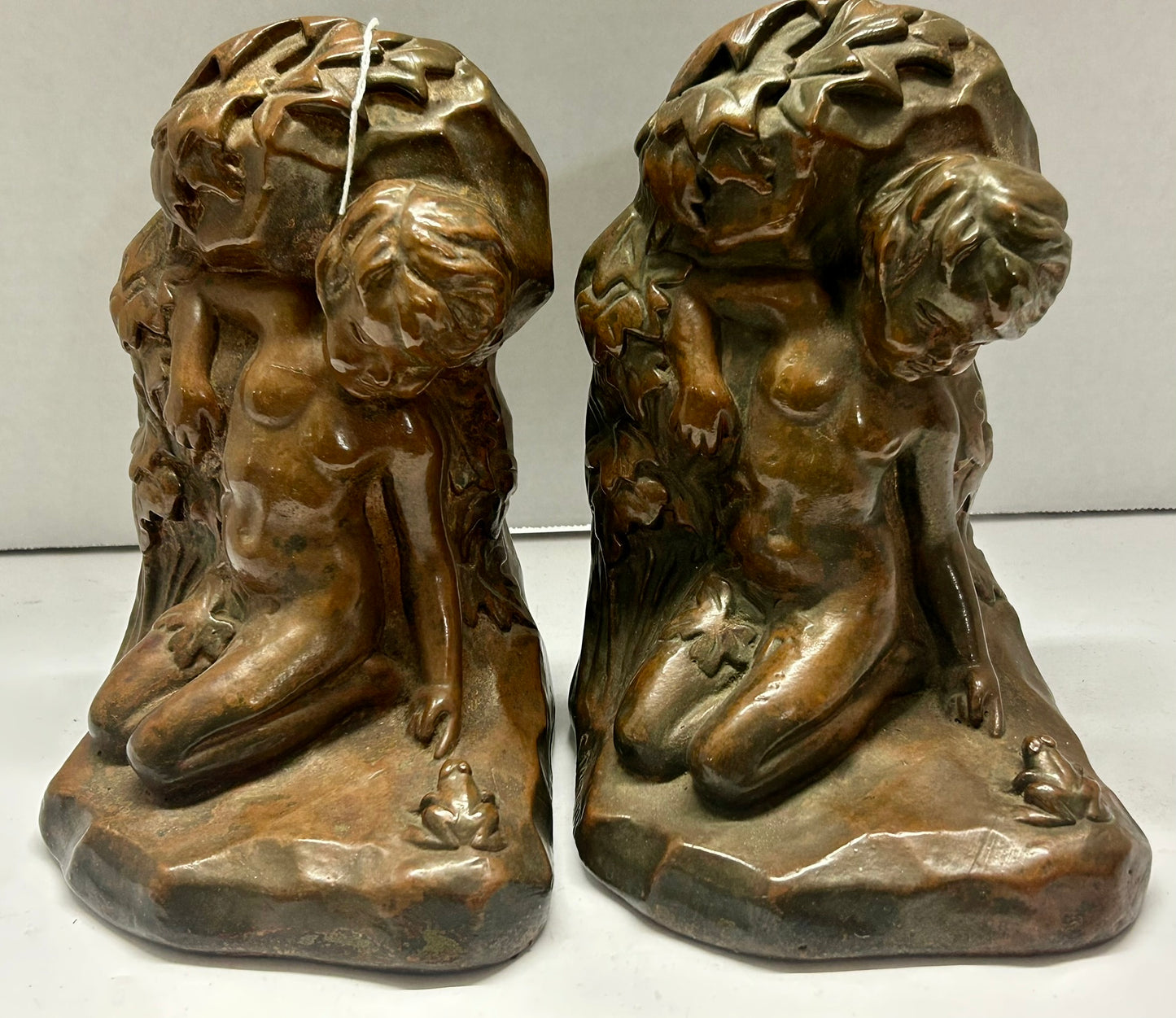 BRONZE CLAD BOOKENDS FIGURAL BOY WITH FROG SIGNED