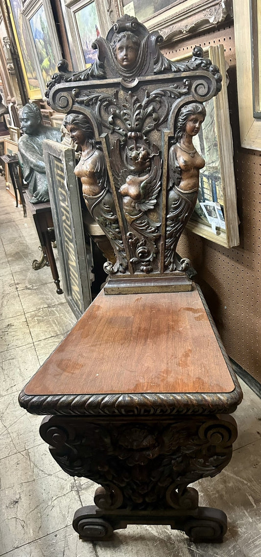 CARVED ANTIQUE CHAIR WITH FEMALE DECORATIONS