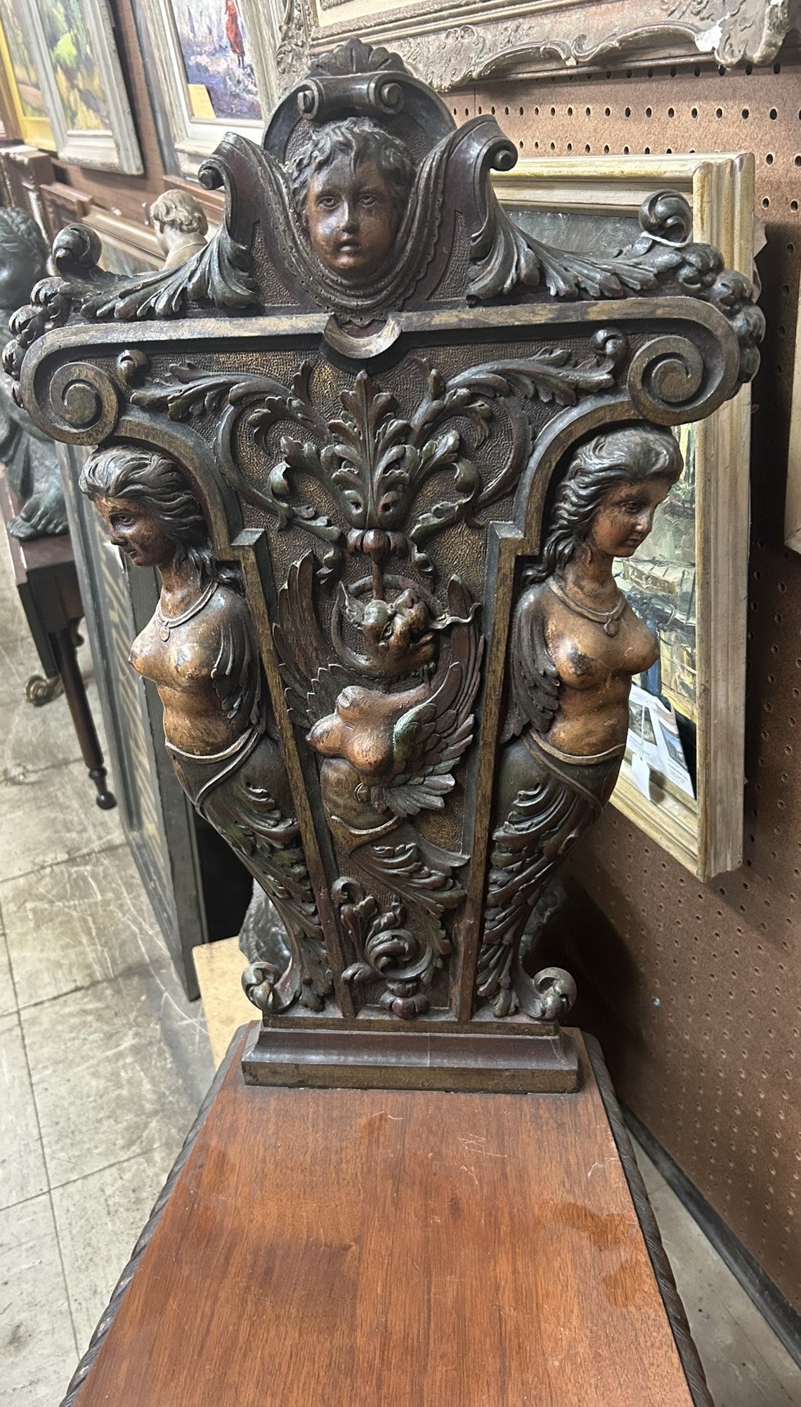 CARVED ANTIQUE CHAIR WITH FEMALE DECORATIONS