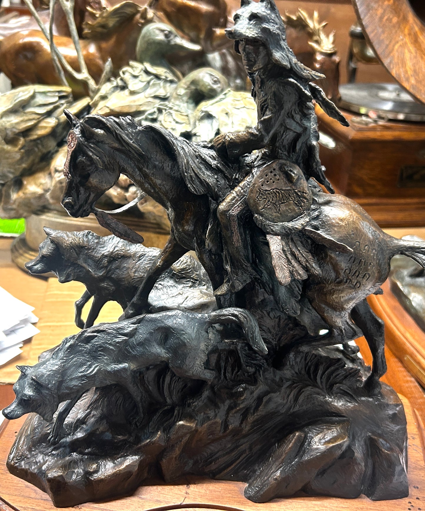 KEN PAYNE BRONZE SCULPTURE OF NATIVE AMERICAN ON HORSE AND THREE WOLVES