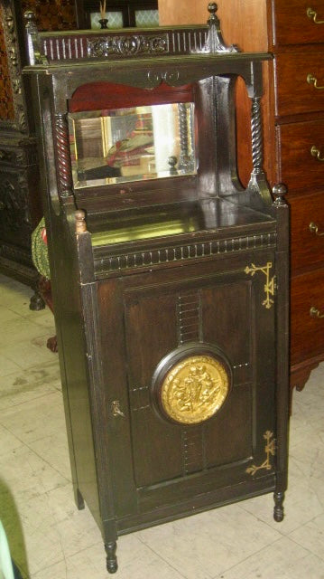 ANTIQUE BLACK EBONIZED MUSIC STAND WITH BRONZE PLAQUE ON DOOR, POTTIER AND STYMUS?