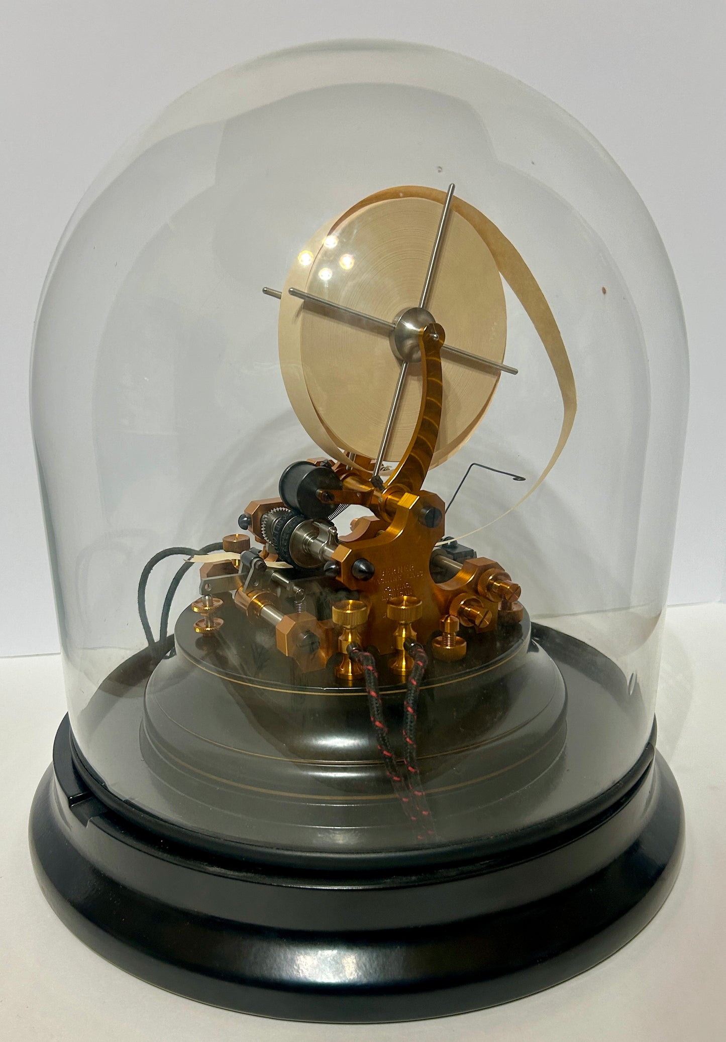 STOCK TICKER TAPE MACHINE WITH GLASS DOME BY BERNER MACHINE LABS