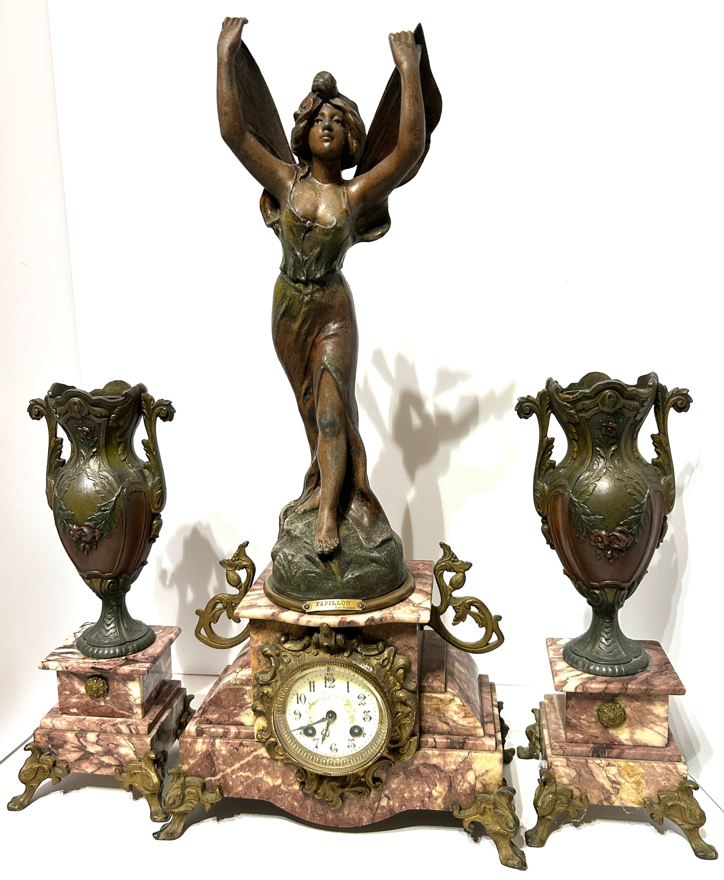 ANTIQUE THREE PIECE FIGURAL BUTTERFLY GIRL CLOCK SET