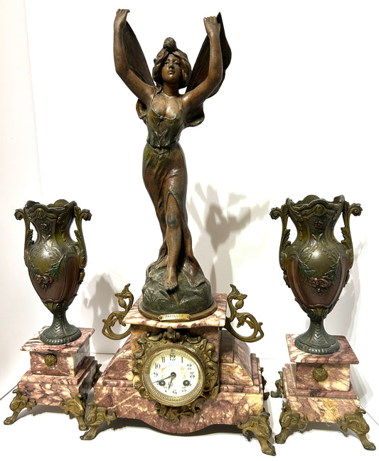 ANTIQUE THREE PIECE FIGURAL BUTTERFLY GIRL CLOCK SET