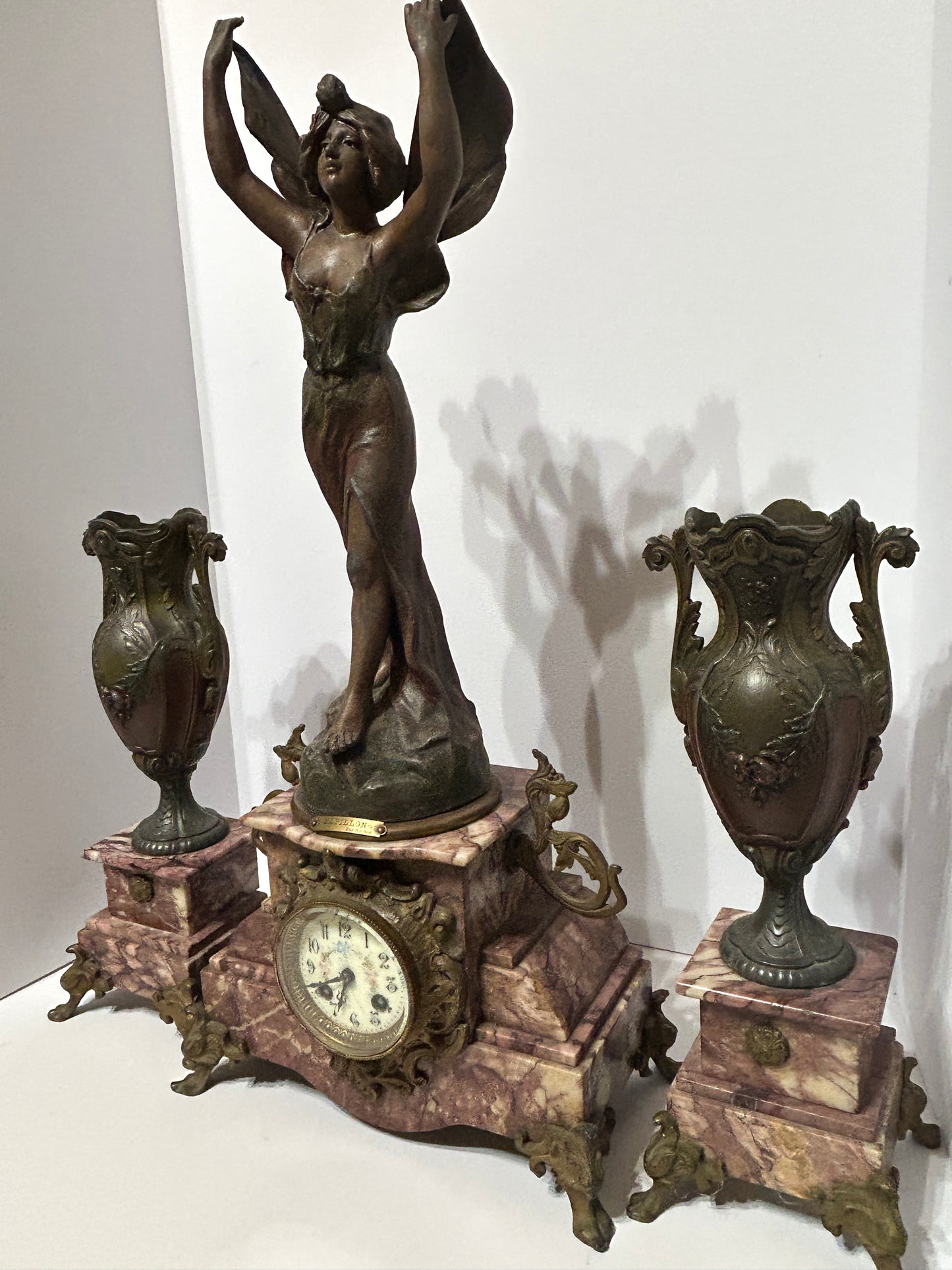 ANTIQUE THREE PIECE FIGURAL BUTTERFLY GIRL CLOCK SET