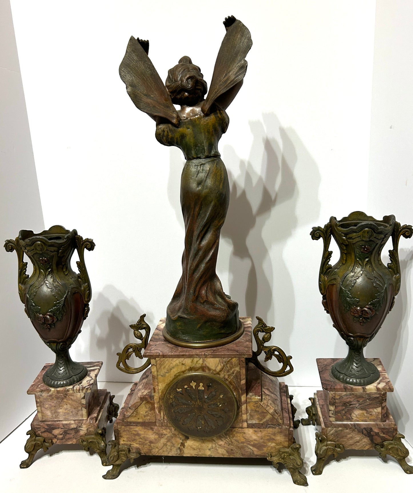 ANTIQUE THREE PIECE FIGURAL BUTTERFLY GIRL CLOCK SET