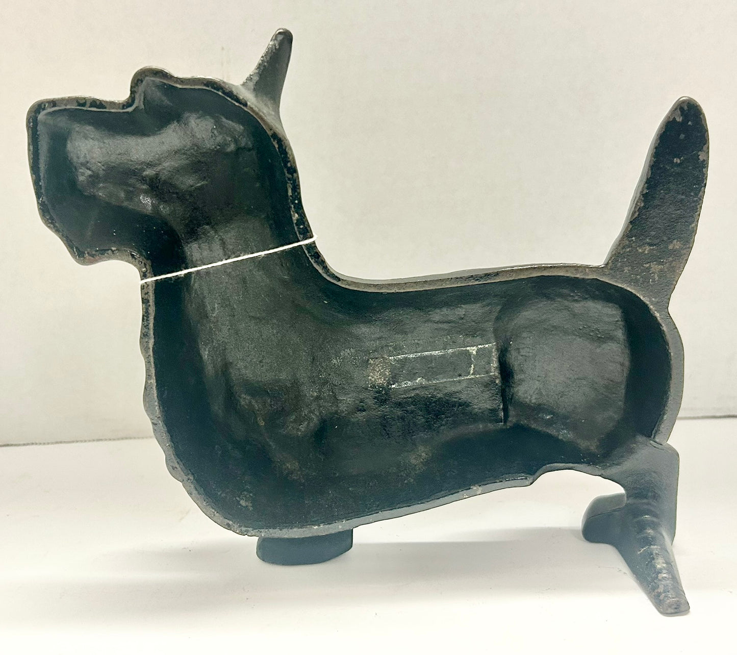 ANTIQUE DOORSTOP OF CAST IRON STANDING SCOTTY DOG