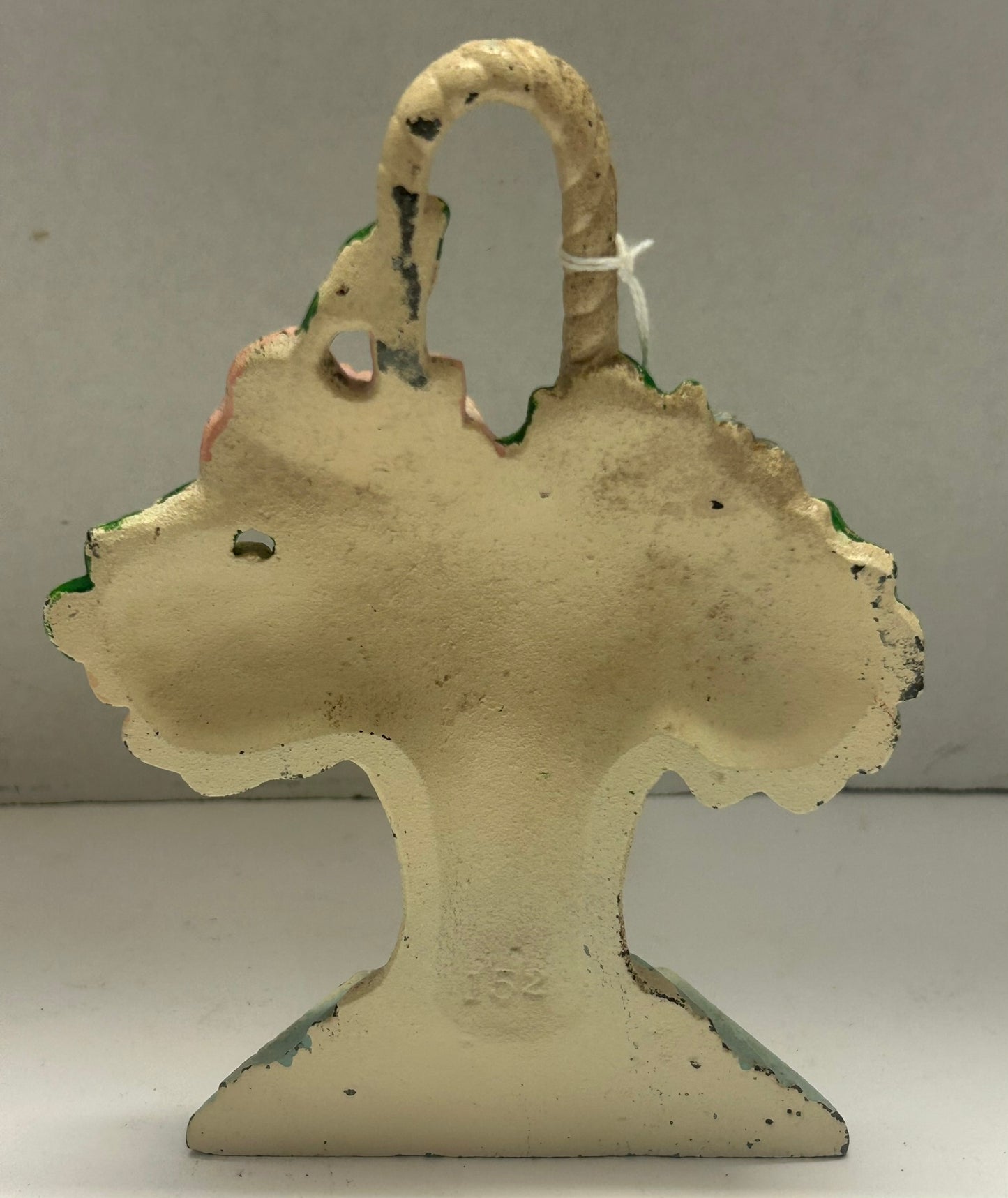 CAST IRON DOORSTOP OF BASKET OF FLORALS