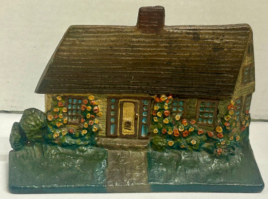 COTTAGE WITH FLOWERS CAST IRON ANTIQUE DOORSTOP