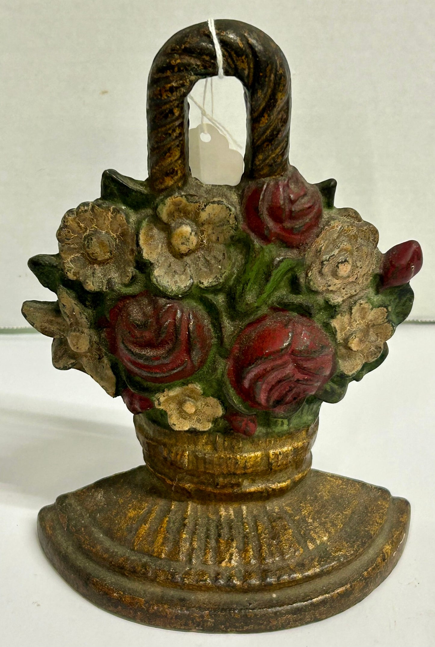 CAST IRON DOORSTOP OF ROSES AND MIXED FLOWERS