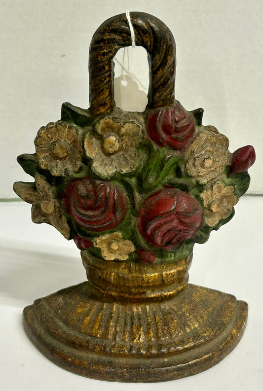 CAST IRON DOORSTOP OF ROSES AND MIXED FLOWERS