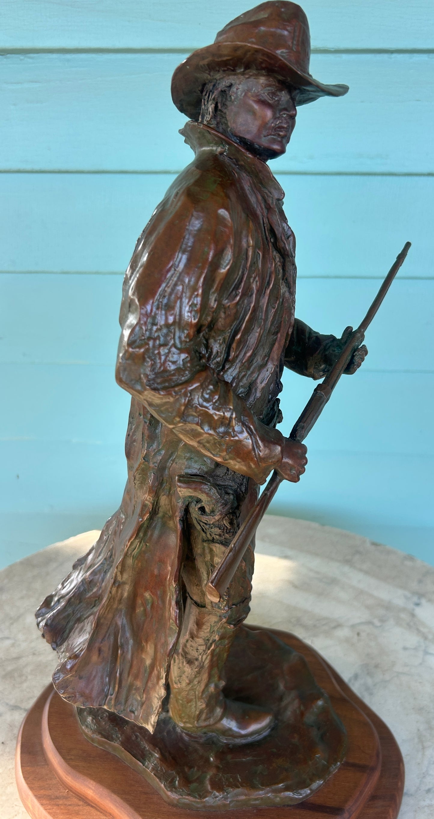 RUSSELL CHRISTENSEN, NEOLA IOWA BRONZE SCULPTURE COWBOY HOLDING RIFLE