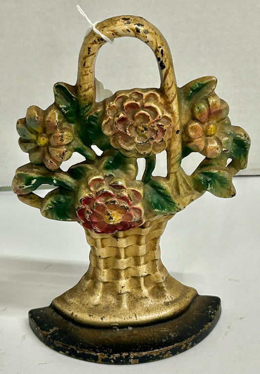 CAST IRON DOORSTOP OF FLOWERS IN WICKER BASKET