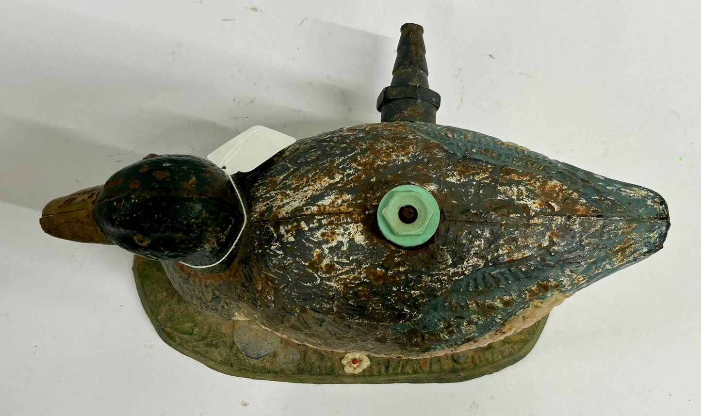 ANTIQUE CAST IRON FIGURAL DUCK ON GRASS LAWN SPRINKLER