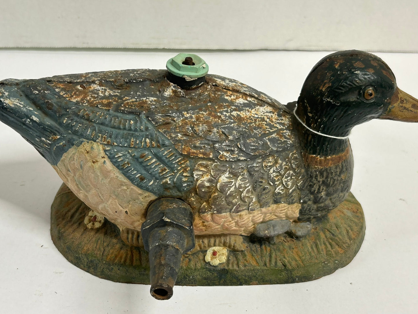 ANTIQUE CAST IRON FIGURAL DUCK ON GRASS LAWN SPRINKLER