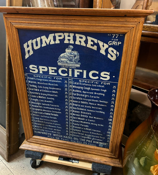 HUMPHREYS' SPECIFICS CABINET WITH 34 DRAWERS INSIDE AND ADVERTISING TIN FRONT