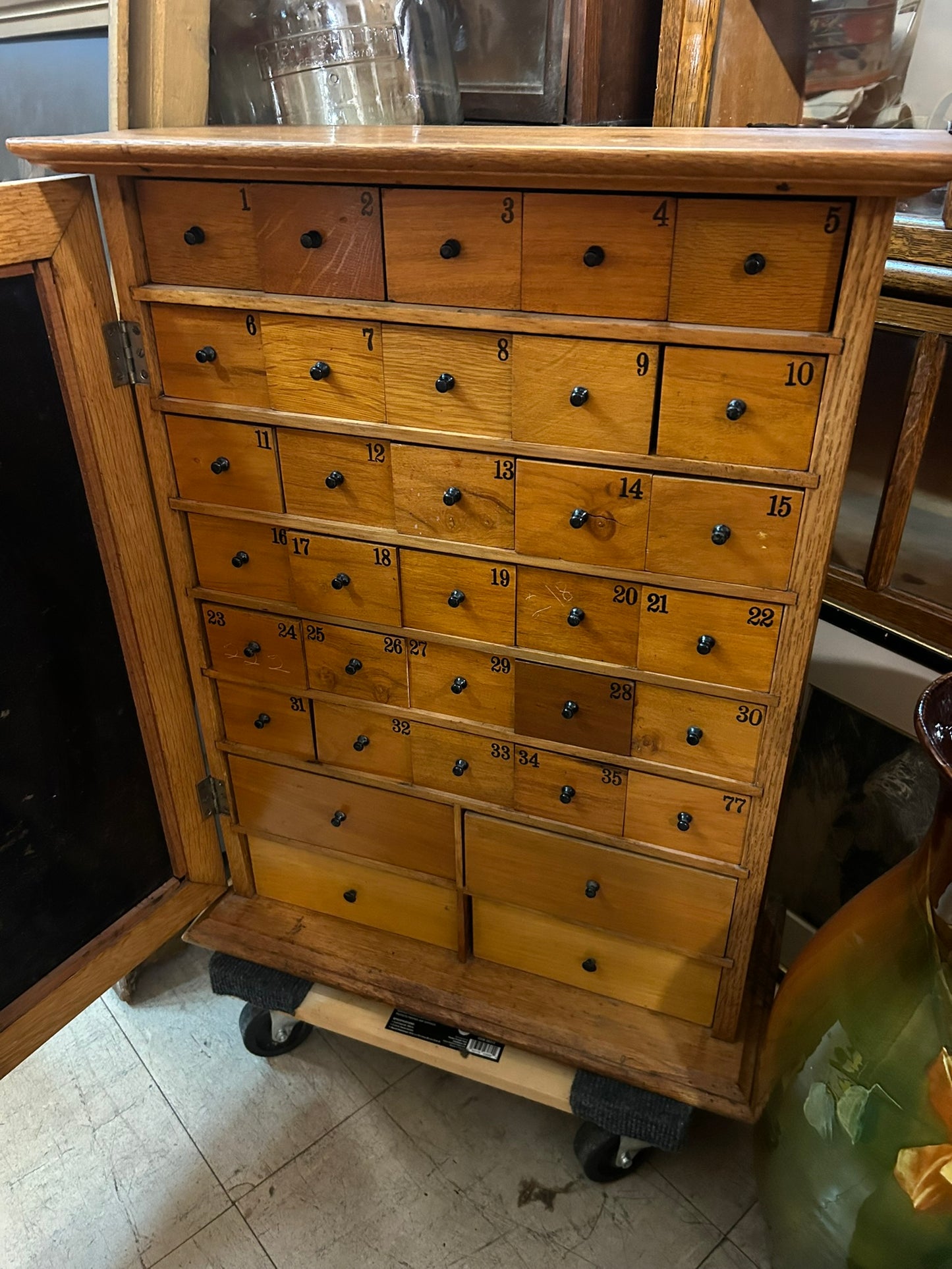 HUMPHREYS' SPECIFICS CABINET WITH 34 DRAWERS INSIDE AND ADVERTISING TIN FRONT