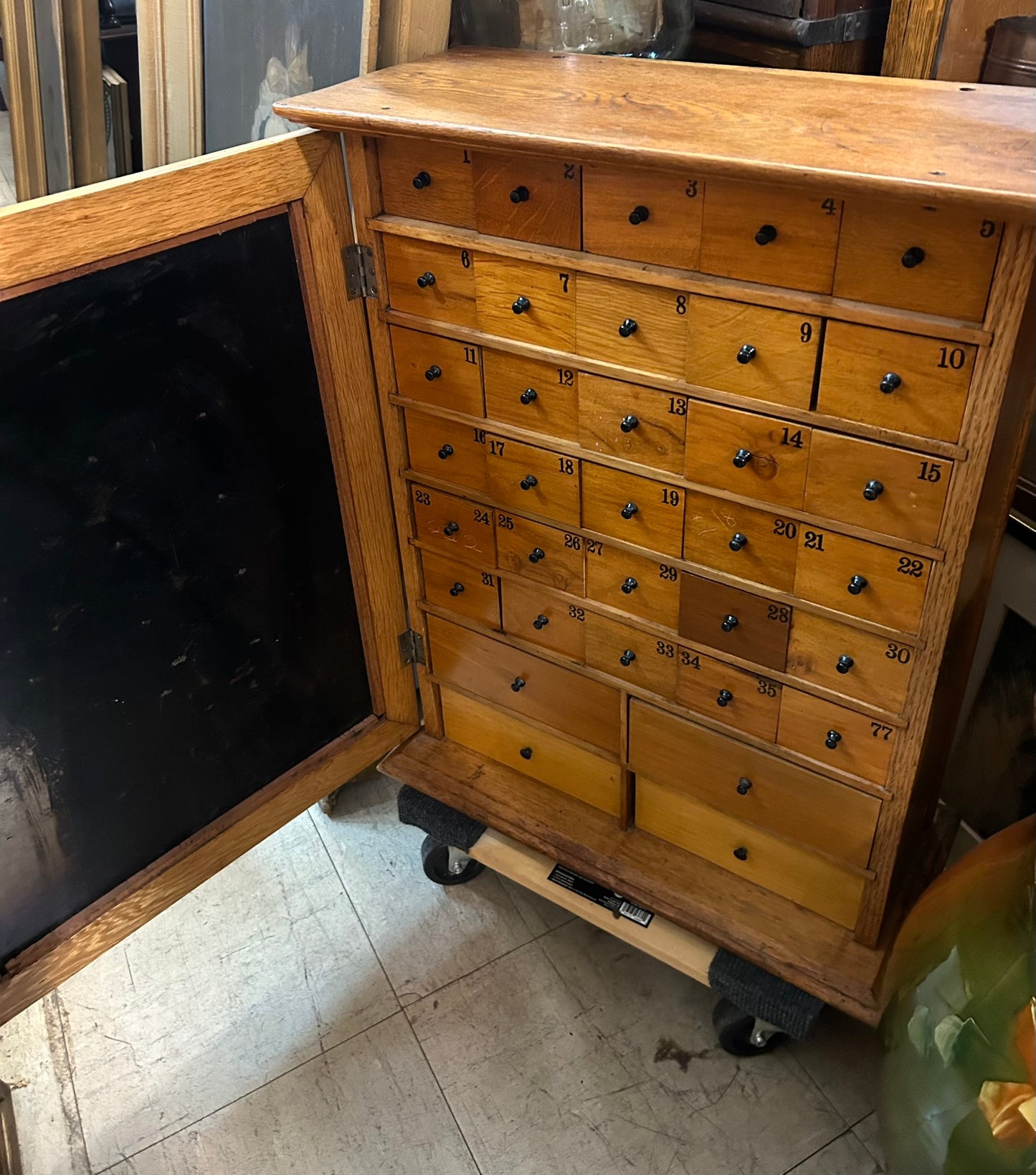 HUMPHREYS' SPECIFICS CABINET WITH 34 DRAWERS INSIDE AND ADVERTISING TIN FRONT