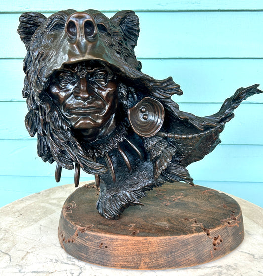 KEVIN MCCARTHY BRONZE SCULPTURE OF NATIVE AMERICAN WEARING BEAR HEAD DRESS