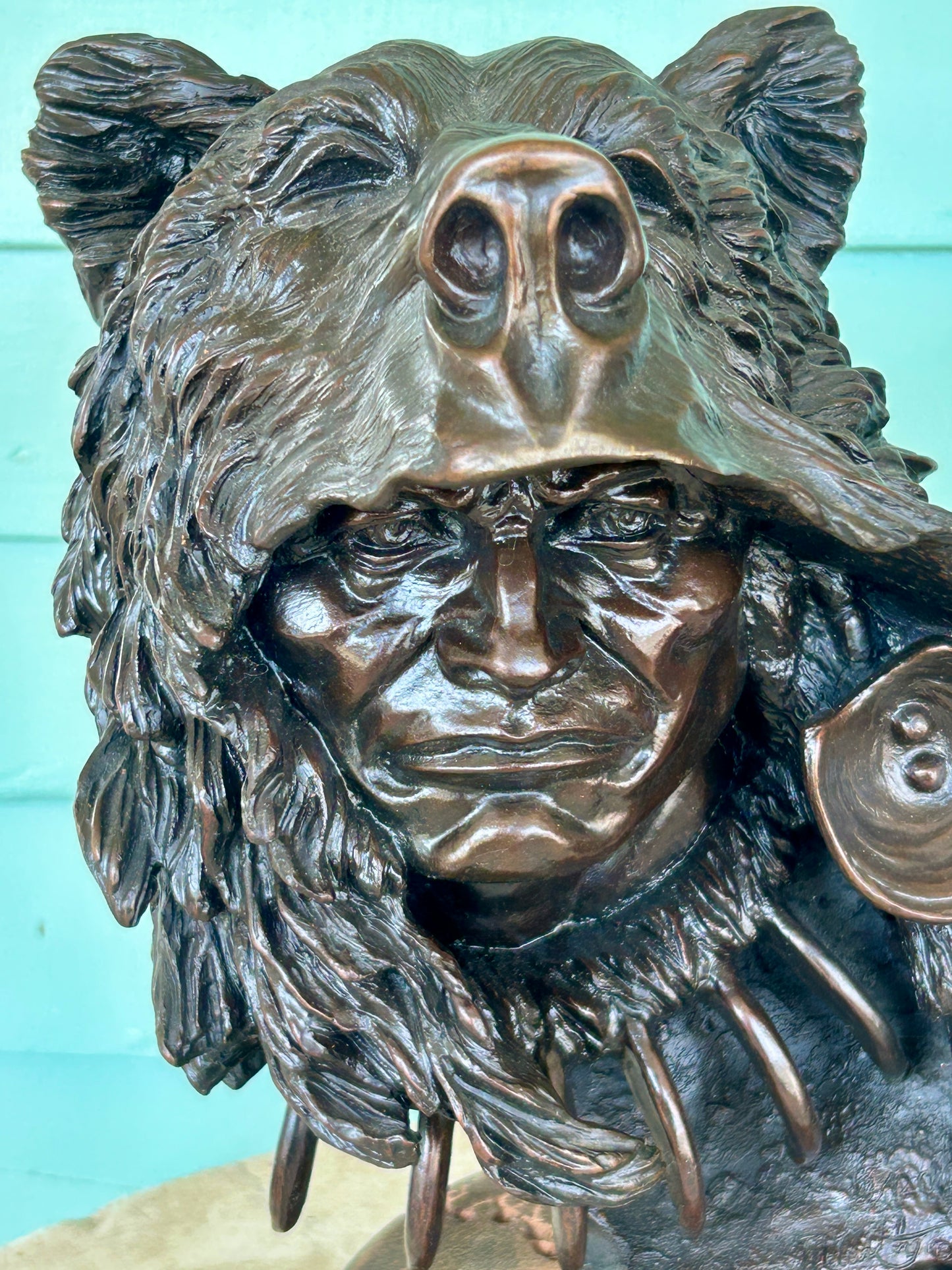 KEVIN MCCARTHY BRONZE SCULPTURE OF NATIVE AMERICAN WEARING BEAR HEAD DRESS