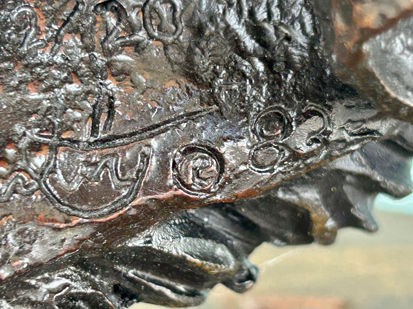 KEVIN MCCARTHY BRONZE SCULPTURE OF NATIVE AMERICAN WEARING BEAR HEAD DRESS