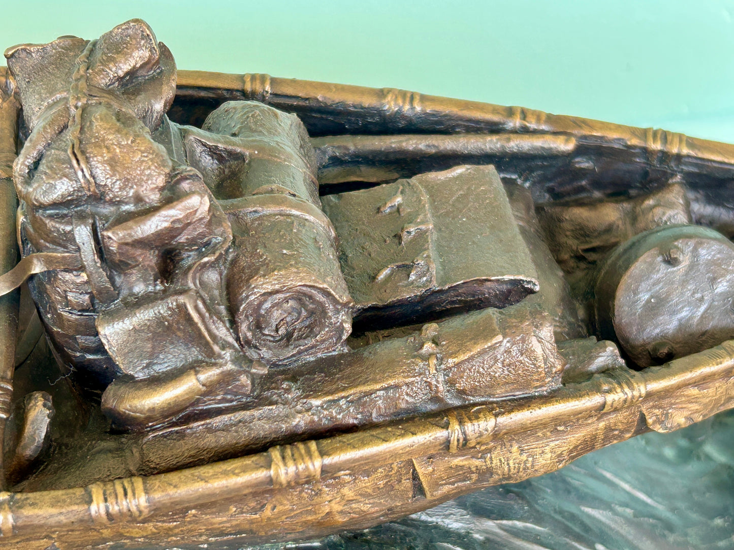 WILLIAM J. KOELPIN SR. WISCONSIN BRONZE SCULPTURE OF FUR TRAPPER IN BOAT