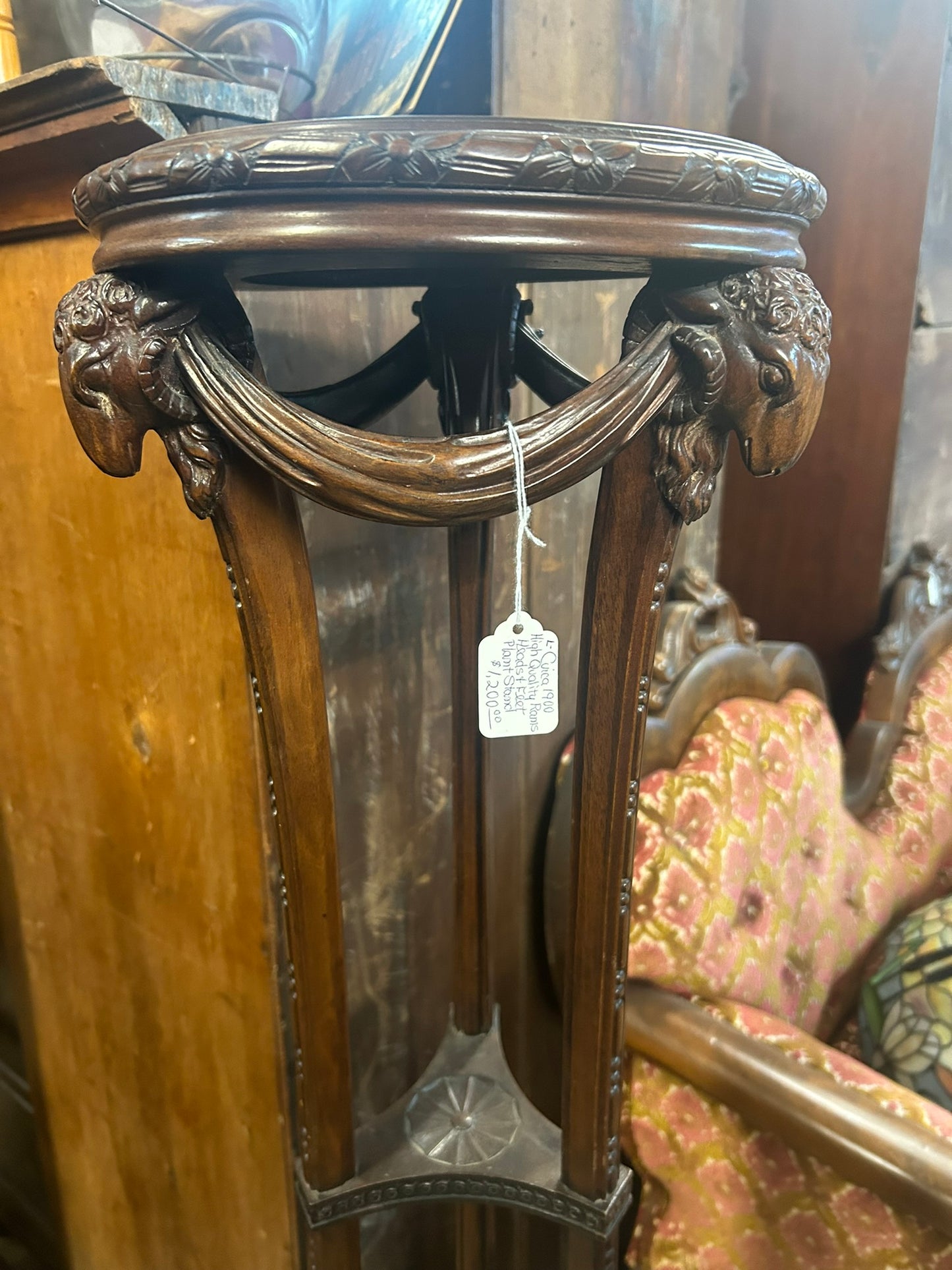 ANTIQUE WOOD TALL STAND WITH RAM'S HEADS AND FEET