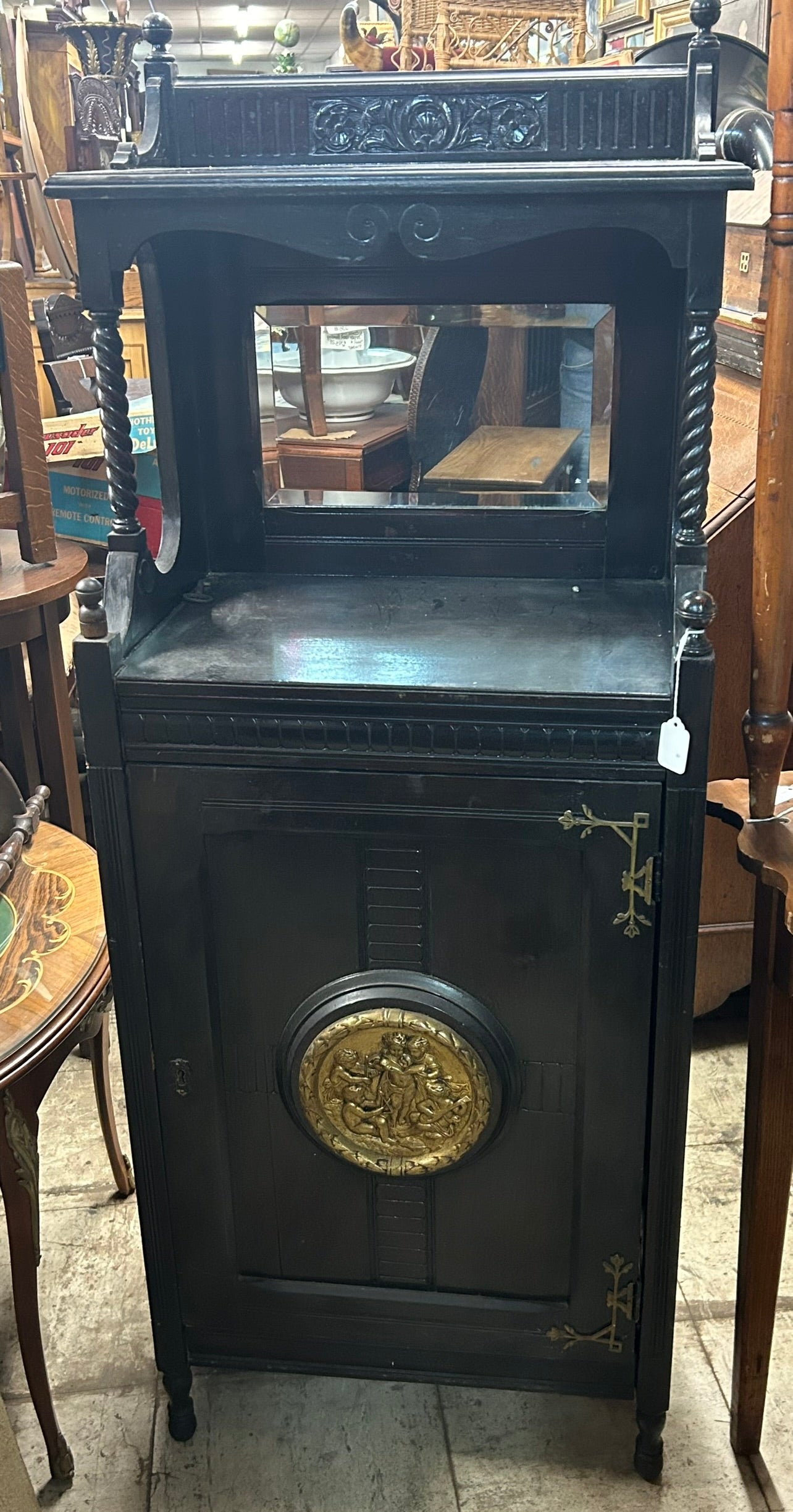 ANTIQUE BLACK EBONIZED MUSIC STAND WITH BRONZE PLAQUE ON DOOR, POTTIER AND STYMUS?