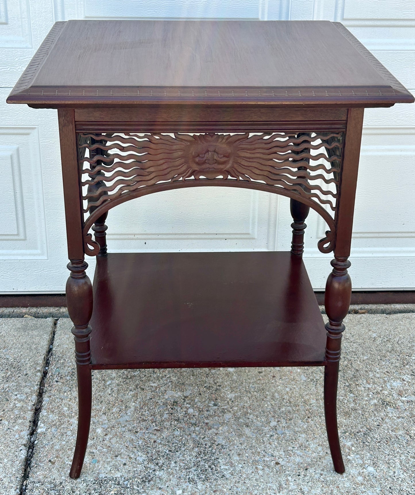 ANTIQUE MAHOGANY STAND WITH UNUSUAL SUN FACES ON SIDES