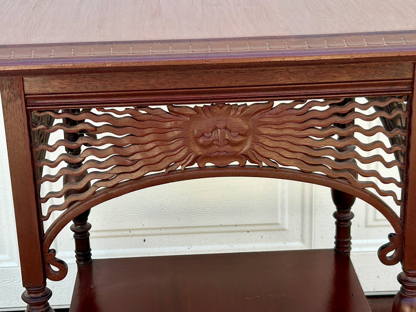 ANTIQUE MAHOGANY STAND WITH UNUSUAL SUN FACES ON SIDES