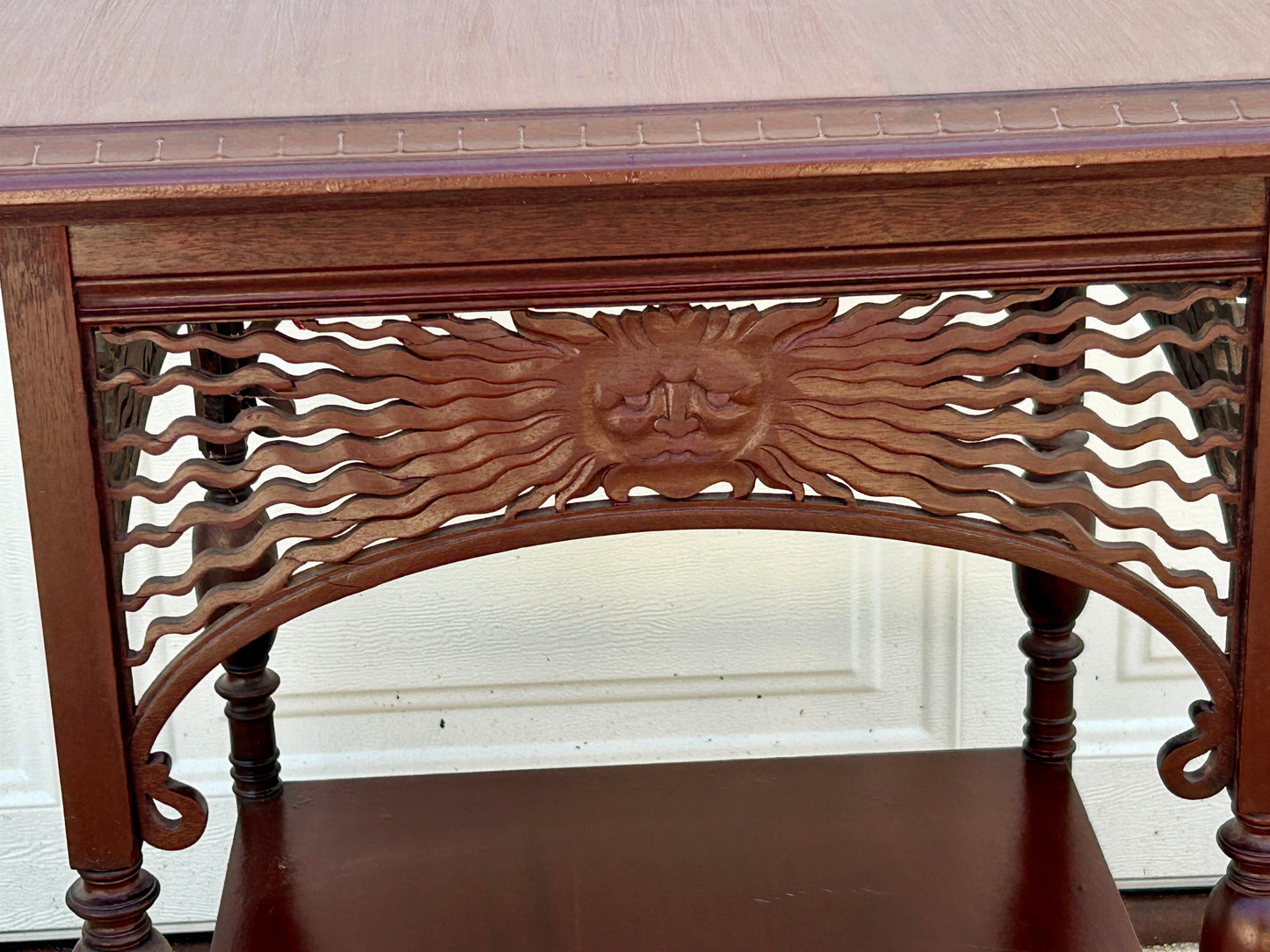ANTIQUE MAHOGANY STAND WITH UNUSUAL SUN FACES ON SIDES