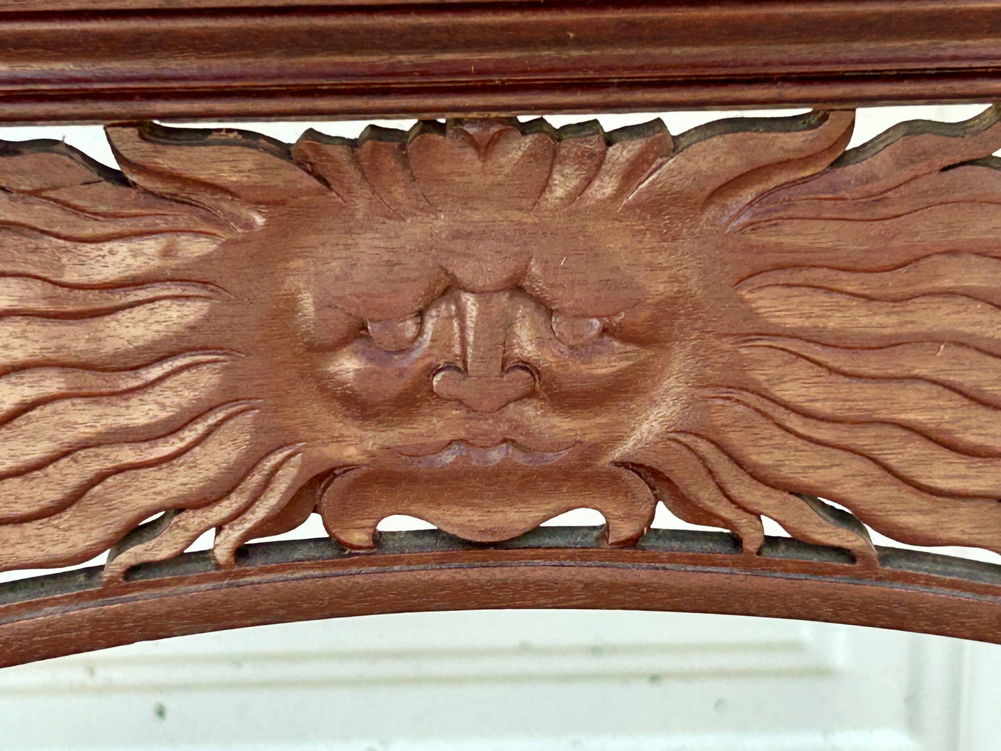 ANTIQUE MAHOGANY STAND WITH UNUSUAL SUN FACES ON SIDES
