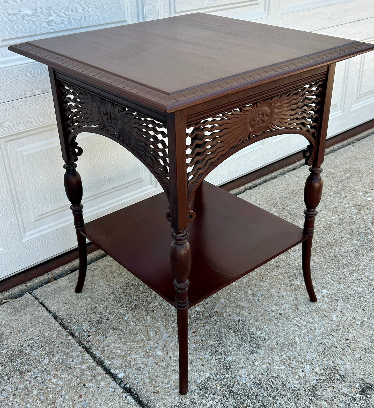 ANTIQUE MAHOGANY STAND WITH UNUSUAL SUN FACES ON SIDES